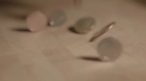 Dropping coins in slow motion Stock Footage 56776064