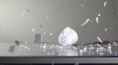 Dropping cup of coffee and breaking Stock Footage 68346187