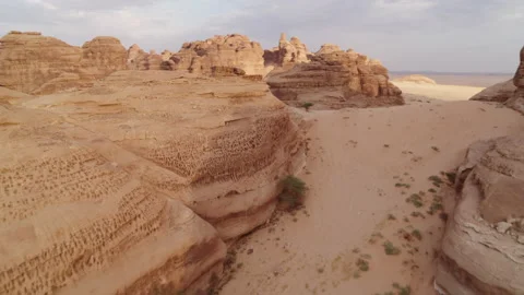 Dropping down into canyon, Saudi Arabia. Rock and sand. Aerial 4K. Al Ula. Stock Footage 196834546