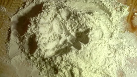 Dropping egg on flour, means for making cookies Stock Footage 231897104