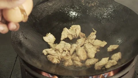 Dropping an egg into a hot saucepan  Stock Footage 88571104