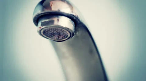 Dropping faucet close-up Stockbeeldmateriaal 23613226