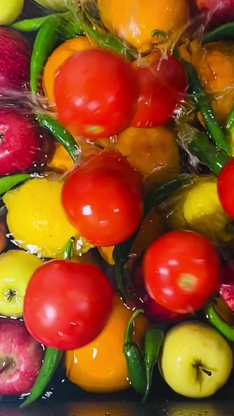 Dropping Fresh Red Tomatoes into Water Close-up Slow Motion Stock Footage 338205485