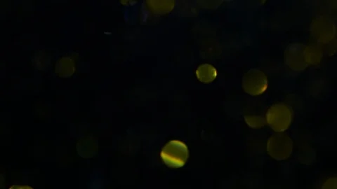 Dropping gold powder into the water Stock Footage 102298680
