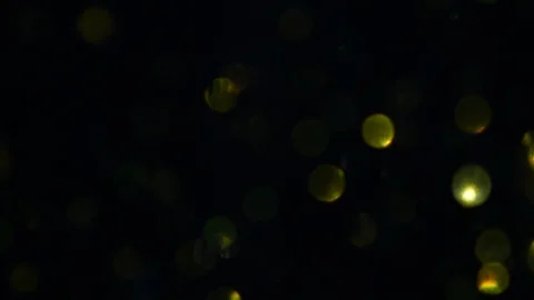 Dropping gold powder into the water Stock Footage 102396064