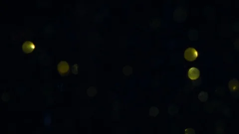 Dropping gold powder into the water Stock Footage 102402246