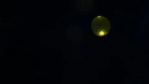 Dropping gold powder into the water Stock Footage 102413619