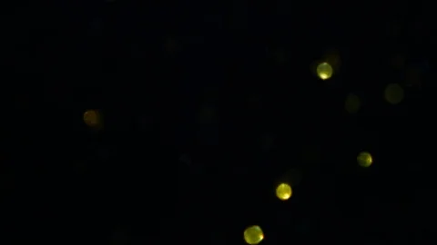Dropping gold powder into the water Stock Footage 102416623
