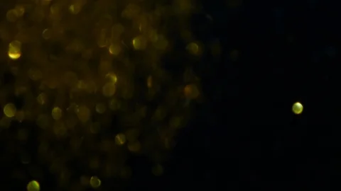 Dropping gold powder into the water Stock Footage 102416831