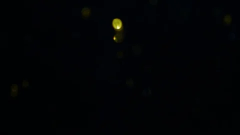 Dropping gold powder into the water Stock Footage 102422363