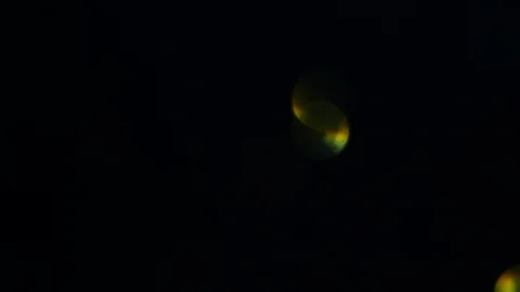 Dropping gold powder into the water Stock Footage 102426809