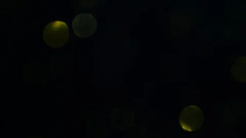 Dropping gold powder into the water Stock Footage 102427638