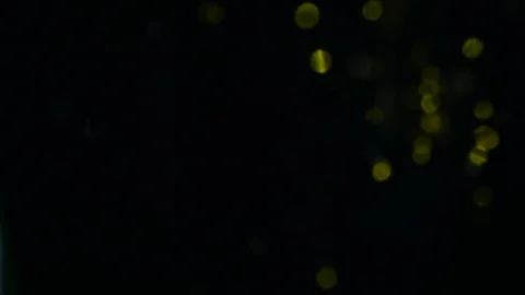 Dropping gold powder into the water Stock Footage 102436185