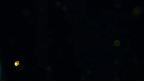 Dropping gold powder into the water Stock Footage 102437170