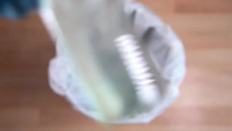 Dropping Hand Sanitiser In White Bin Stock Footage 157174114