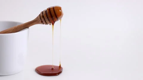 Dropping honey Stock Footage 147310546