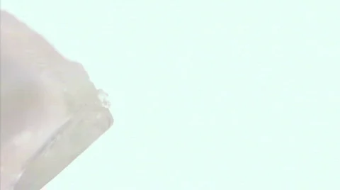 Dropping Ice Cubes and Pouring a Drink, Vertical, close up Stock-Footage 329067