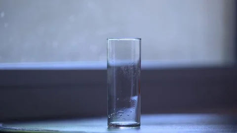 Dropping Ice cubes into a glass in slow motion Stock Footage 70237465