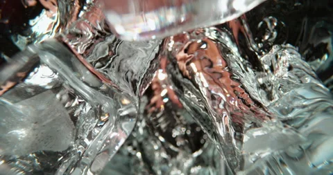 Dropping ice cubes into water Stock Footage 311826777