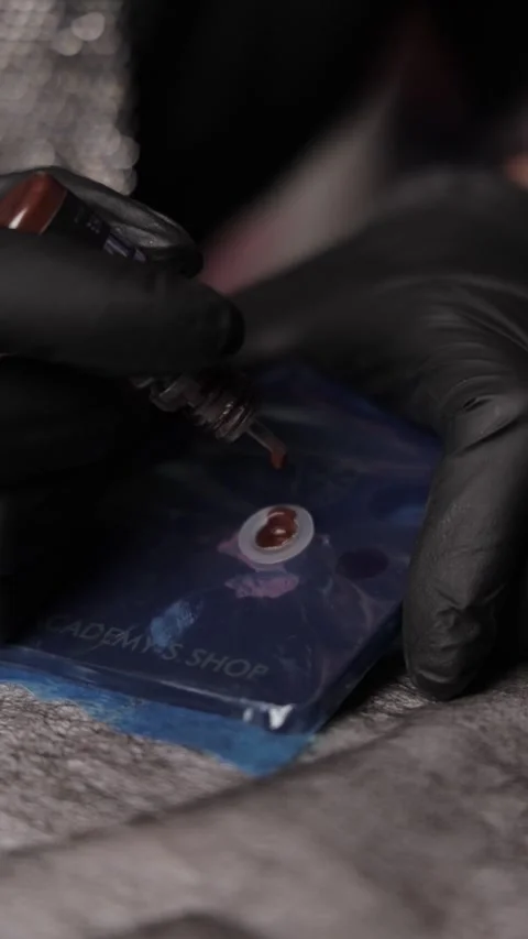 Dropping Ink for a Tattoo Machine Stock Footage 300481138