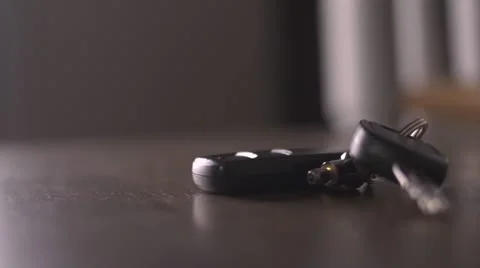 Dropping Keys on Table Stock Footage 12669912
