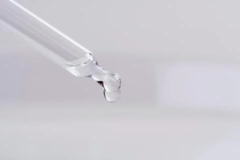 Dropping a liquid from a pipette Stock Photos