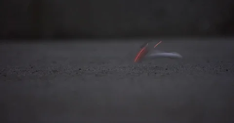 Dropping a lit cigarette on the ground Stock Footage 71784145