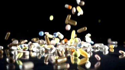Dropping Medical Pills - Slow Motion Stock Footage