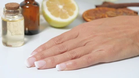 Dropping oil on hand close up Stock Footage 117428890