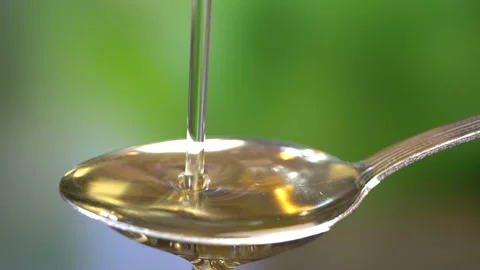 Dropping olive oil in Slow motion Stock Footage 87809996