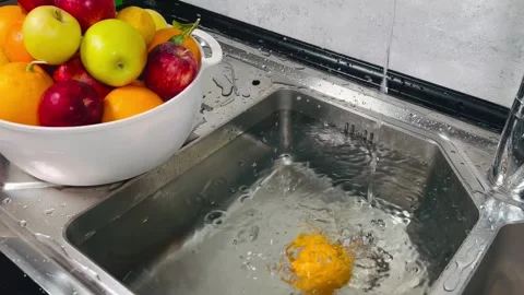 Dropping orange into water, 16:9 widescreen footage Stock Footage 337727504