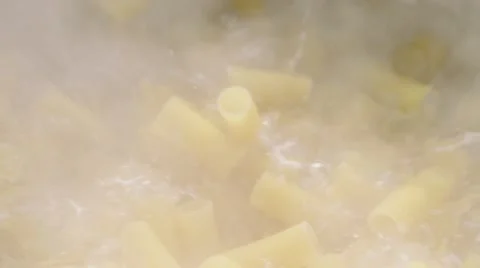 Dropping pasta in hot water Stock Footage 61826809