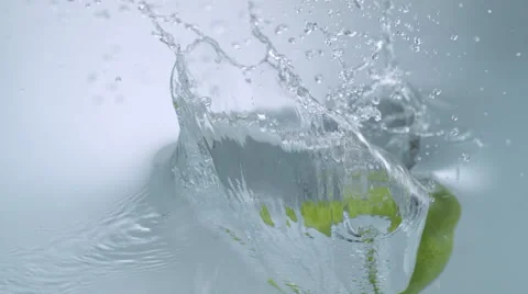 Dropping pear into water. Slow Motion. Stock Footage 56697510