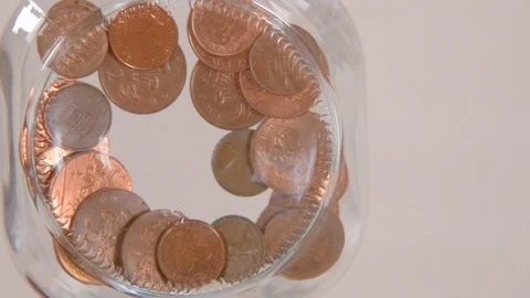 Dropping Pennies into Jar Copy Space Slow Motion Stock Footage 123809707