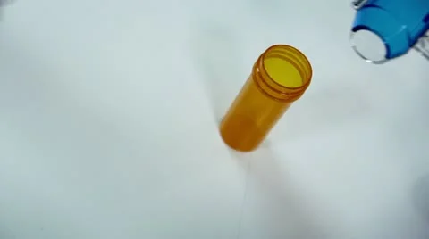 Dropping Pills from a Sorter in a Pill Bottle. Stock Footage 12737487