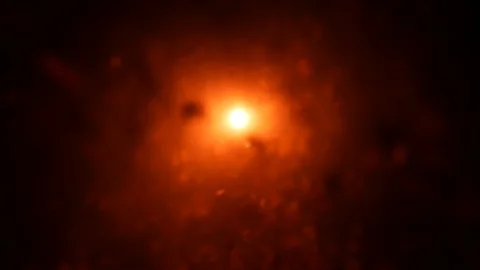 Dropping red ingredient into the water background Stock Footage 104112960