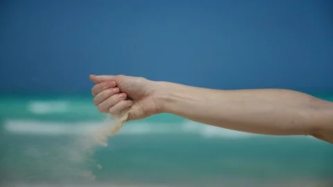 Dropping sand in the wind in slow motion Stock Footage 87170538