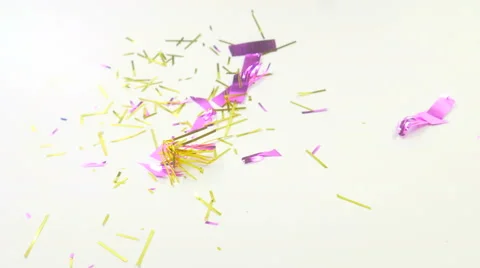 Dropping shredded decorative papers on floor.  Stock Footage 64740138