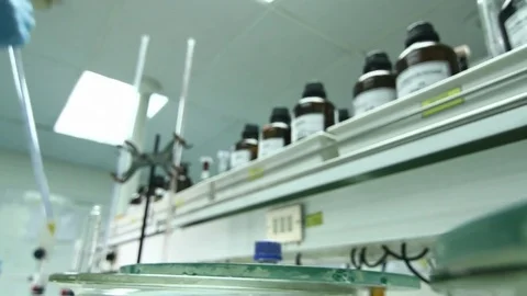 Dropping solution in lab Stock Footage 77101034