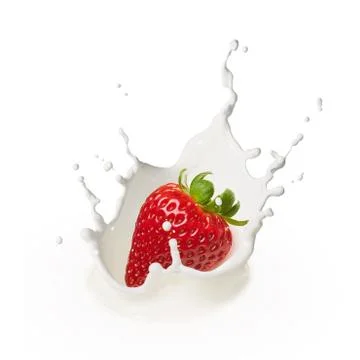 Dropping strawberry into milk Stock Photos