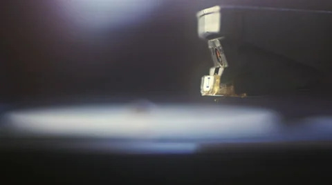 Dropping stylus needle on vinyl record playing. Abstract background Stock Footage 65439597