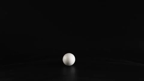 Dropping Styrofoam Ball in Darkness Stock Footage 293550444