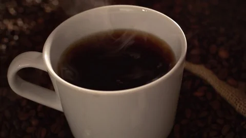 Dropping sugar in a coffee in slow motion Stock Footage 76100866