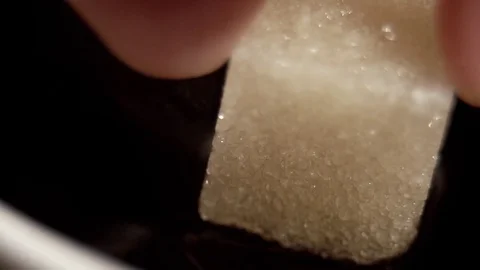 Dropping sugar in coffee in slow motion Stock Footage 76201075