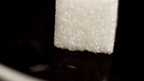 Dropping sugar in slow motion Stock Footage 76201091
