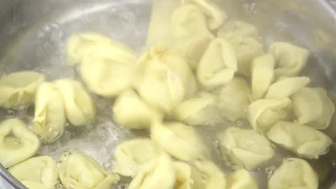 Dropping Tortellini Into Boiling Water Video stock 137865778
