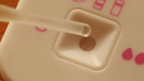 Dropping urine on pregnancy test Stock Footage 123287273