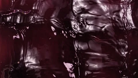 Drops and splashes of red wine and cherry juice texture. 動画素材 268744170
