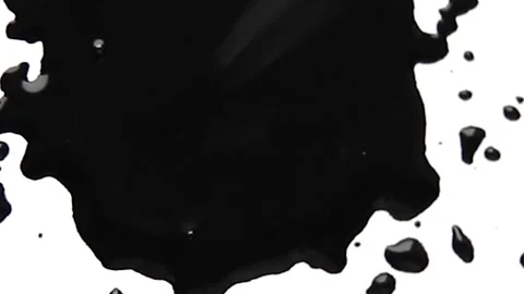 Drops of black ink fall on the paper. Th... | Stock Video | Pond5