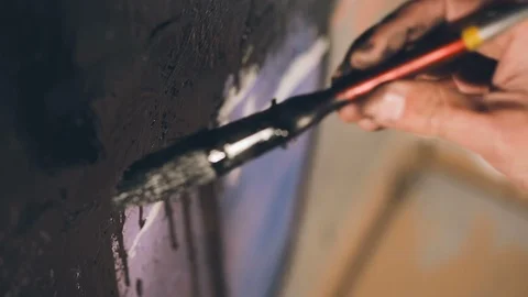 Drops of Black Paint Flowing From Under Brush. Video stock 86236347
